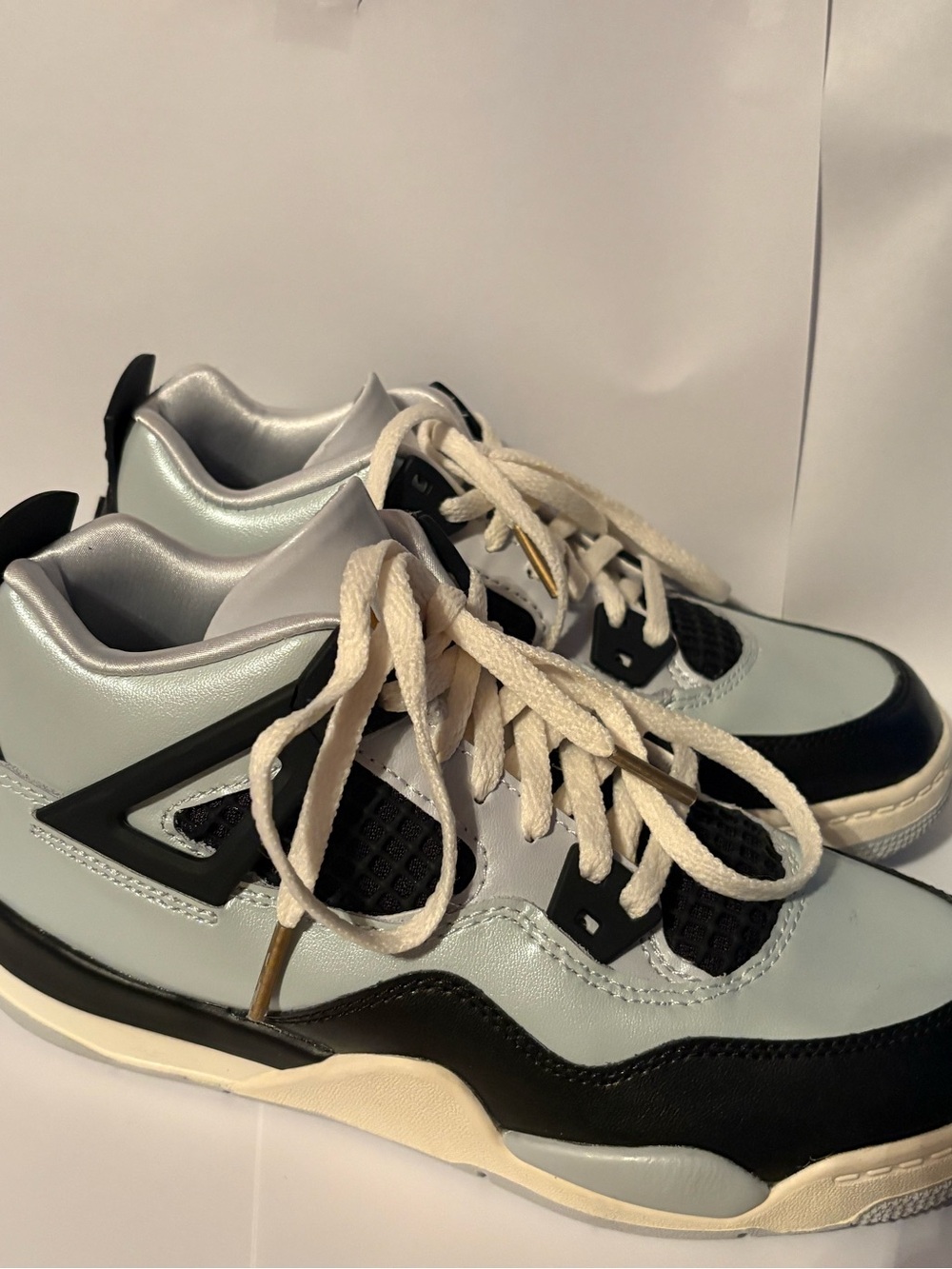 Air Jordan 4 Retro 'Platinum Gold' featuring a metallic gold Jumpman